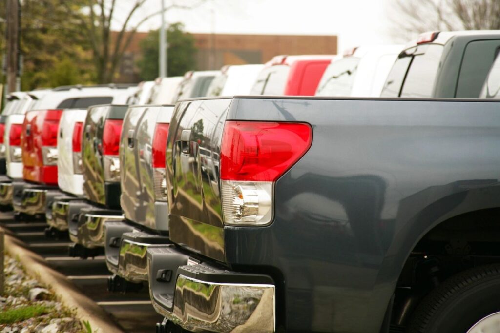 cars lined up in a car lot